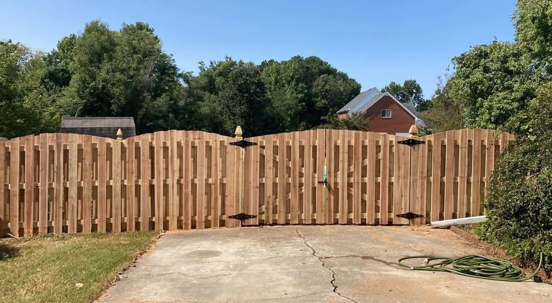 Shadowbox wood fence along a driveway
