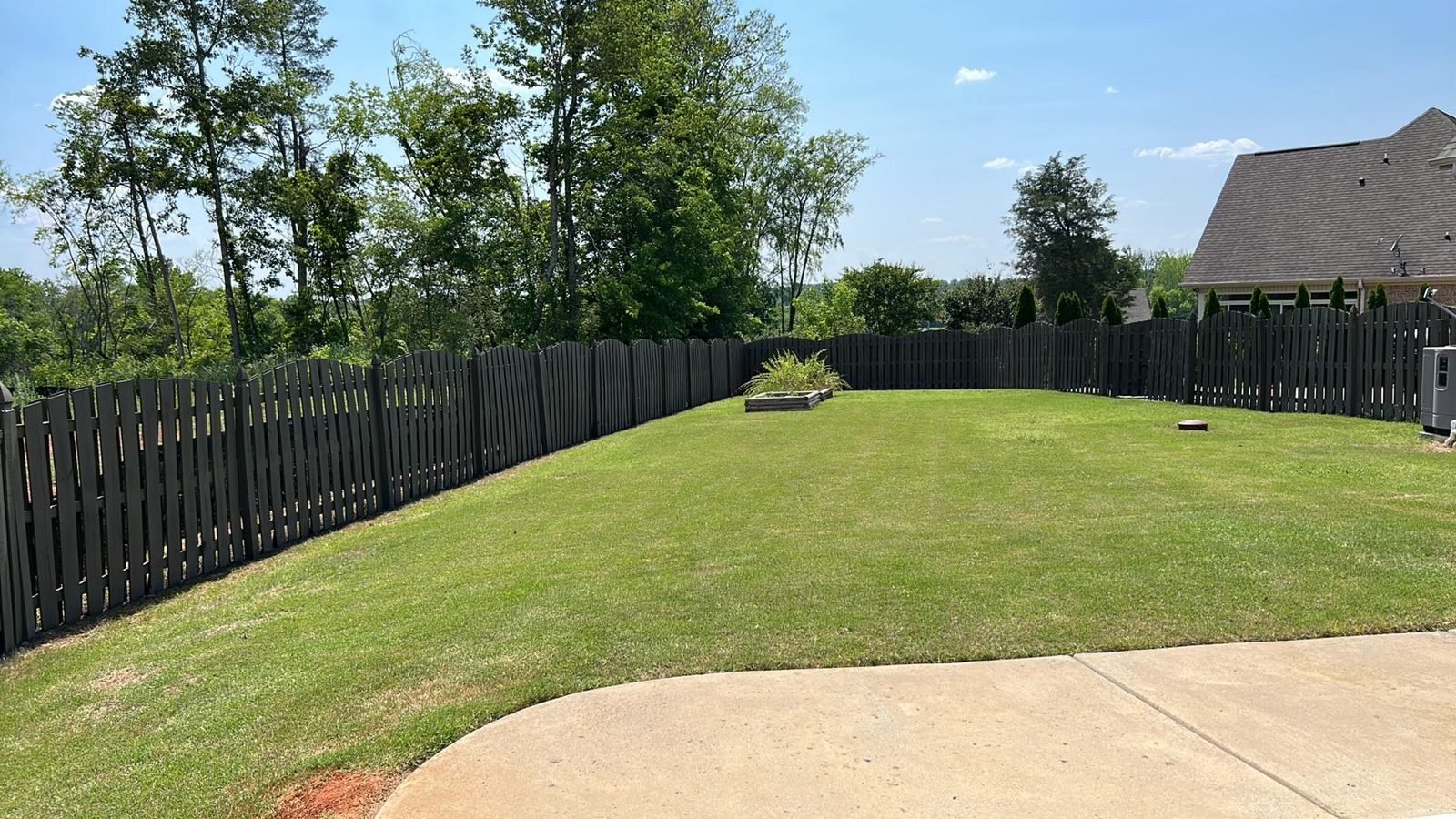 Black aluminum backyard fence